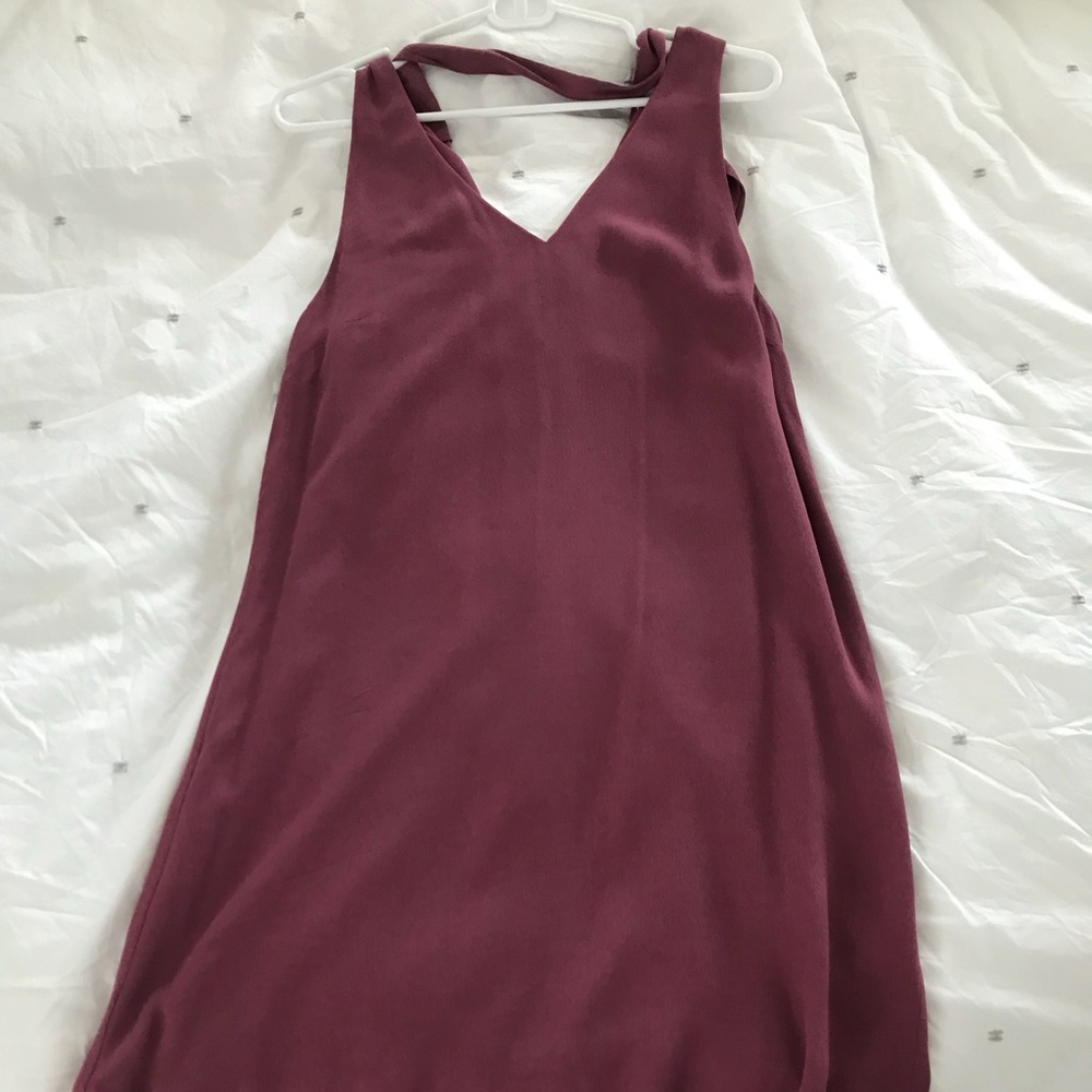Maroon sleeveless dress with neck tie.